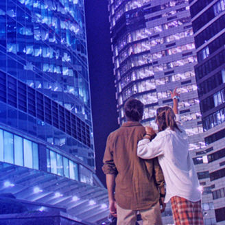Man and woman looking towards the building