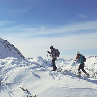 man-and-woman-trekkers-on-snowy-mountain.jpg
