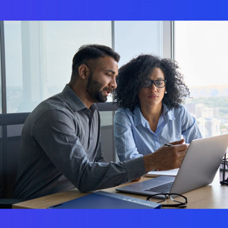 man and women with specs looking at laptop banner