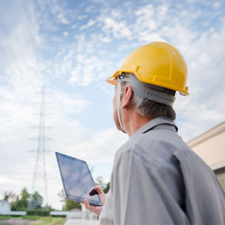 man-at-construction-site-using-tab