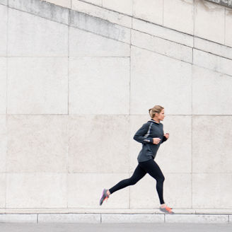 Man climbing stairs and woman running