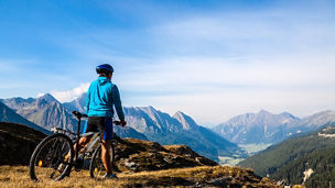 Mountain biking - woman on bike, Dolomites, Italy