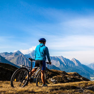 Mountain biking - woman on bike, Dolomites, Italy