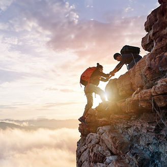 Man helping fellow tracker