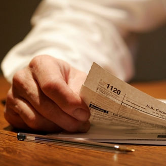 Man holding paper and pen