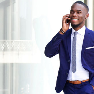 Man in blue suit talking on phone