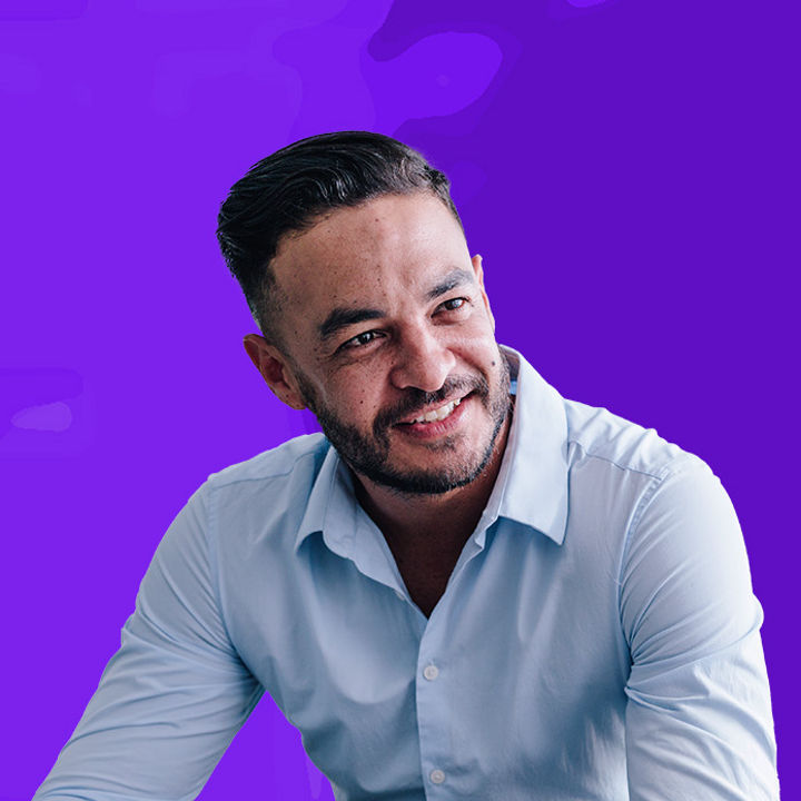 Man in white shirt leaning forward