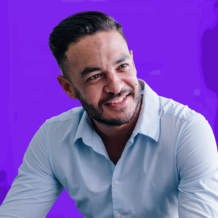 Man in white shirt leaning forward