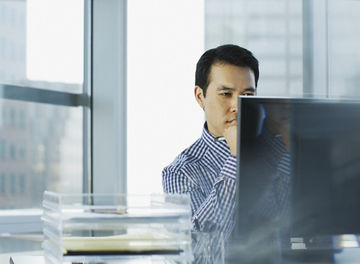 Businessman working at desk in office