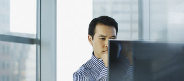 Businessman working at desk in office