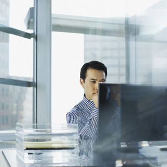 Businessman working at desk in office