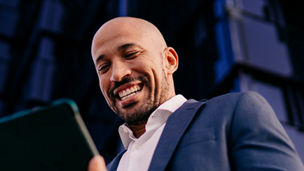 man looking at tablet