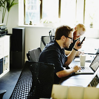 Businessman preparing to make call on smartphone