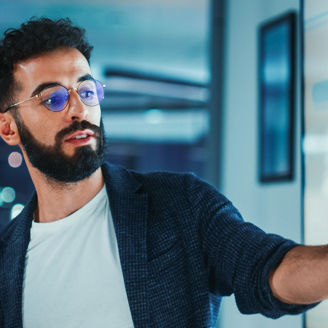 man pointing at board