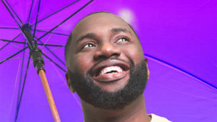 man protected by umbrella