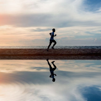 man-running-at-beach-sunset - 1