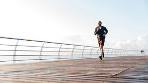 man running on the bridge