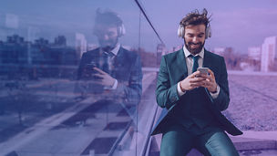 man sitting with phone cover