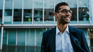 White arrow pointing upwards on the palm of a hand