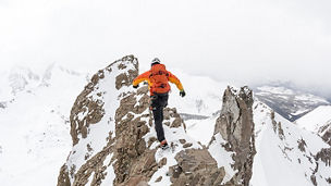 man snow hiking on mountain