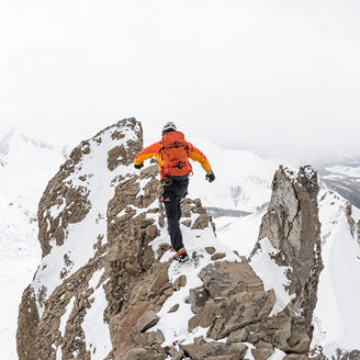 man snow hiking on mountain