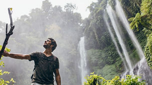 man-standing-near-lake