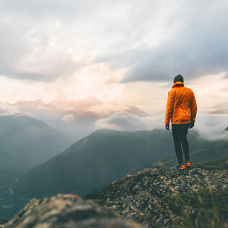 Man standing on mountain top