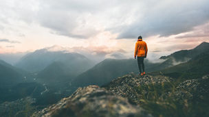 Man standing on mountain top