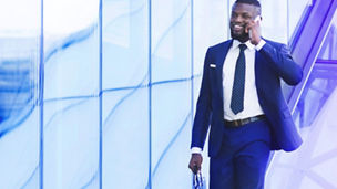 Man Talking on phone while walking