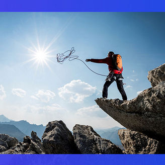 Mountain climber throwing rope