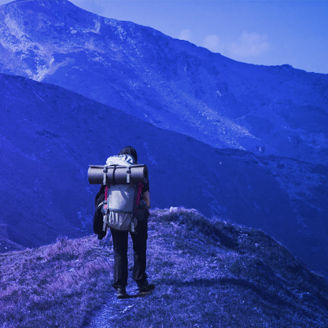man walking on mountain