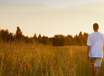 Man walking through a field