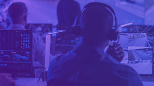 Man wearing headphones viewing digital maps banner