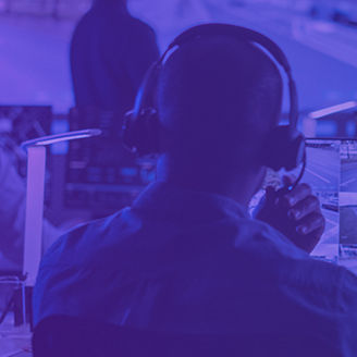 Man wearing headphones viewing digital maps banner