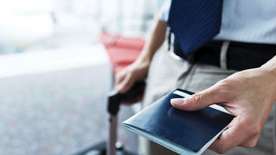 Man with passport in hand on airport