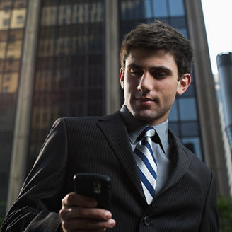 Businessman using a cellular telephone