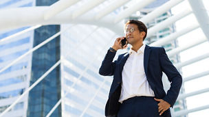 man with specs talking on phone