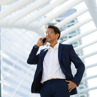 man with specs talking on phone