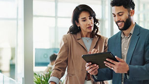 man woman looking at tablet