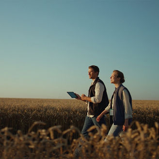 Man woman with tablet in fields