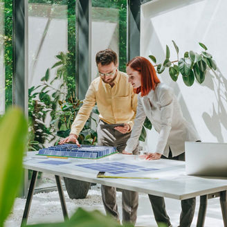 man-woman-working-with-solar-panels