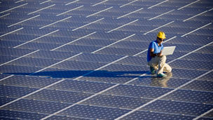 Man working on solar panels