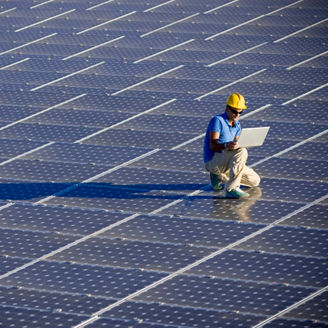 Man working on solar panels