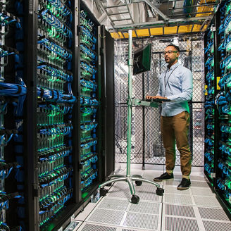 Man working in server room, ServiceNow