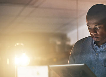 Man looking at tablet