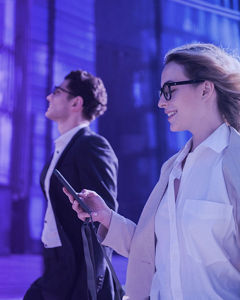 Man and woman walking through the street