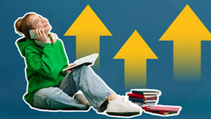 Girl looking up with schoolbooks next to her