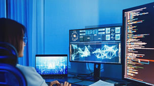 Person working on screens