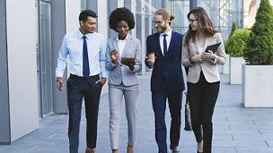 men-and-women-discussing-while-walking