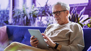 men looking at tablet